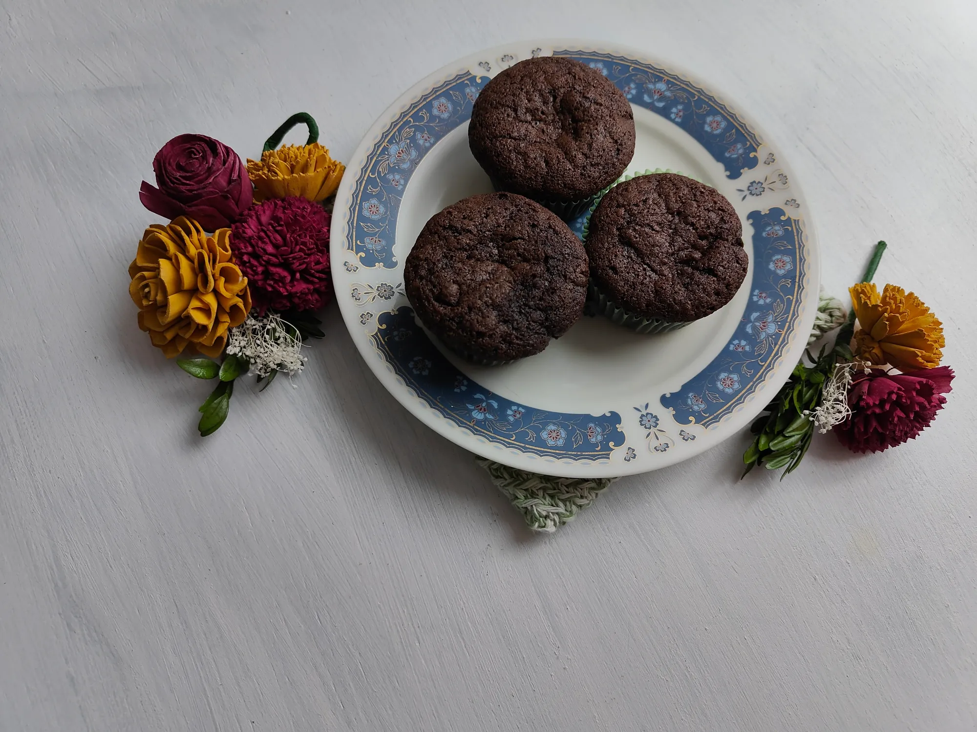 A plate full of chocolate muffins
