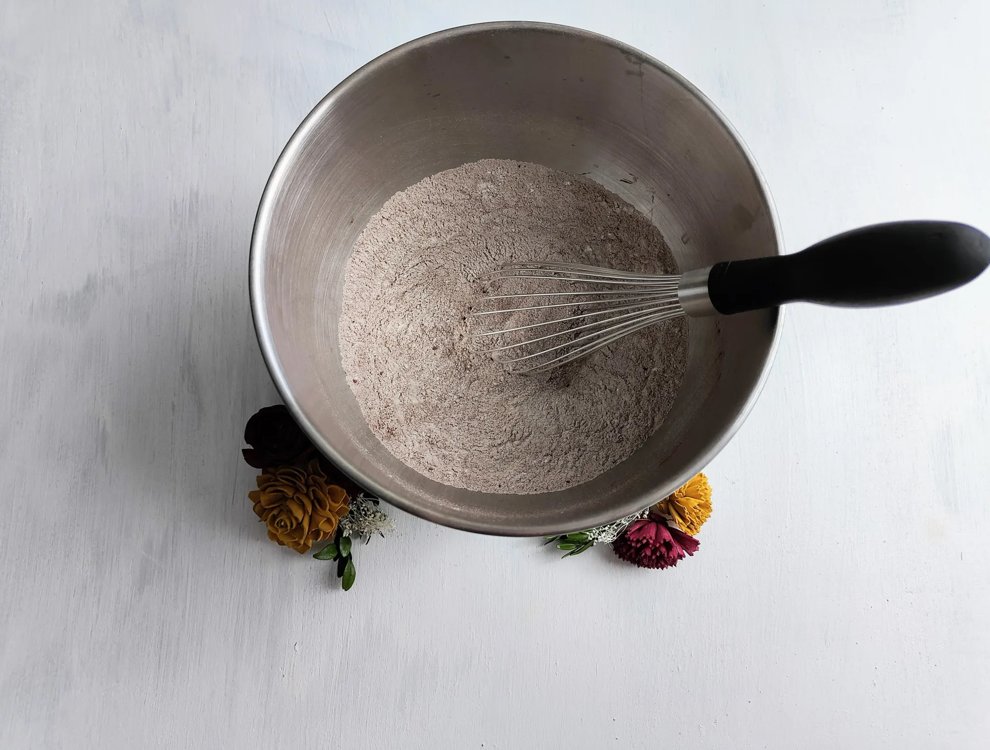 Dry ingredients in a bowl with a whisk