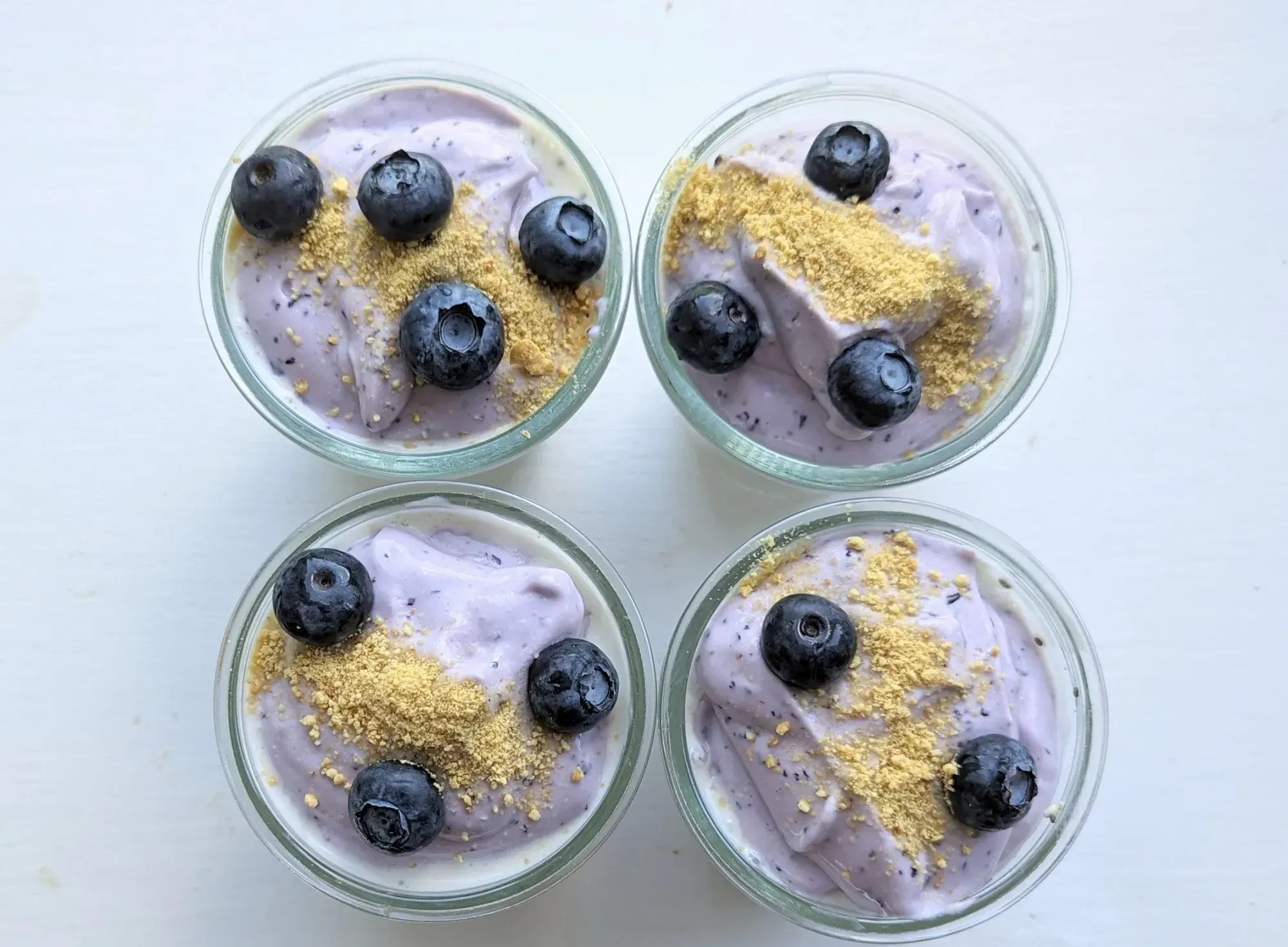 Blueberry overnight oats topped with graham cracker crumbs and blueberries
